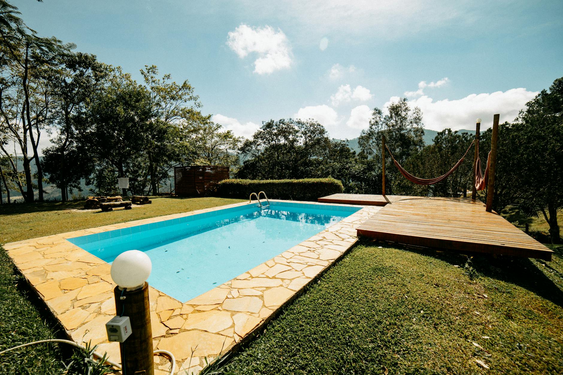 Concrete pool deck installed around a residential swimming pool
