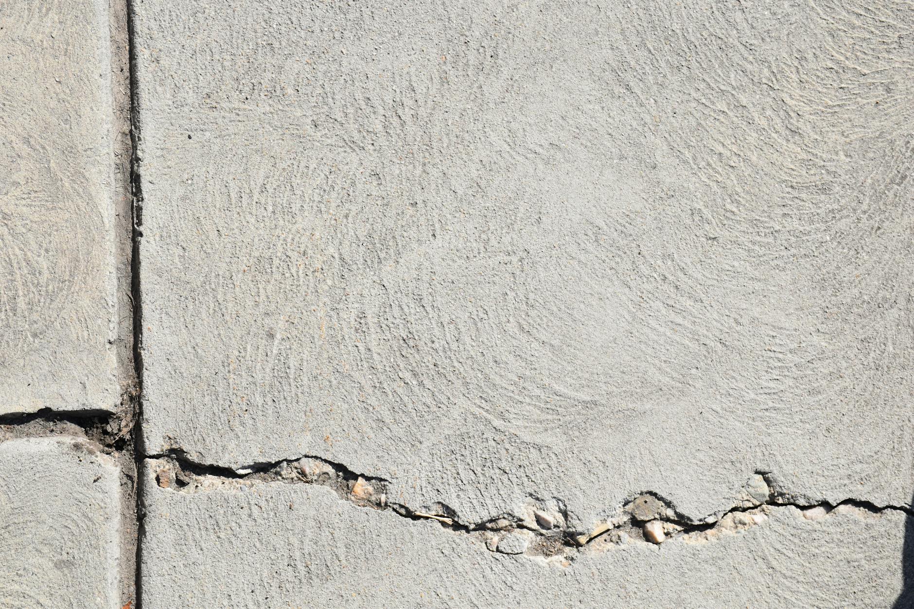 Concrete crack repair and resurfacing on a residential driveway